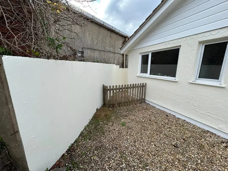 Exterior of a Guernsey property repainted by Woody's Decorating